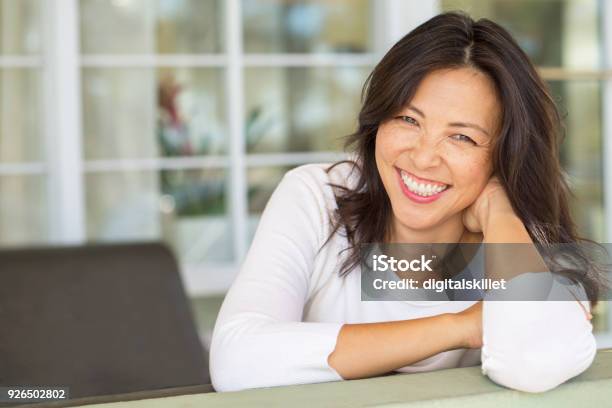 Portrait Of An Asian Woman Smiling Stock Photo - Download Image Now - Women, One Woman Only, Happiness