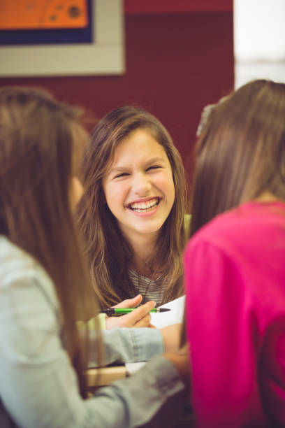 istock Smilng schoolgirl in classroom 926502820