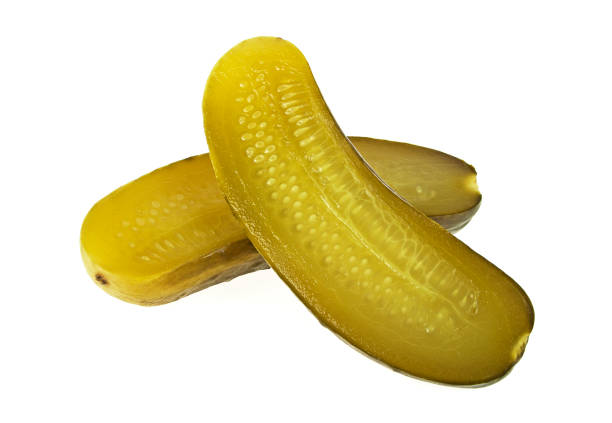 istock One pickled cucumber cut in half on white background 926510260