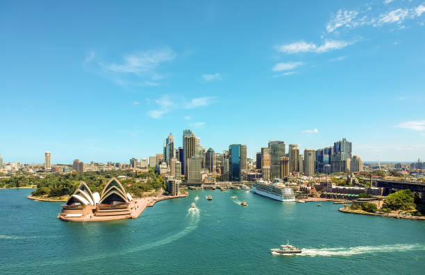 stunning wide angle aerial drone view of the sydney harbour with the opera house, a cruise ship and many skyscrapers in the background. taken near the suburb of kirribilli. new south wales, australia. - circular quay fotos imagens e fotografias de stock