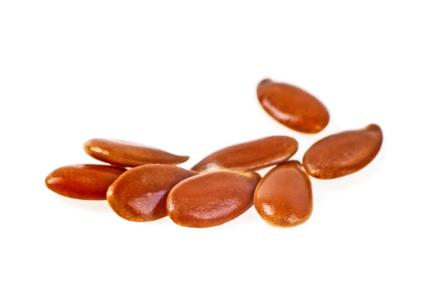istock Close up of flax seeds isolated on white background 926530228