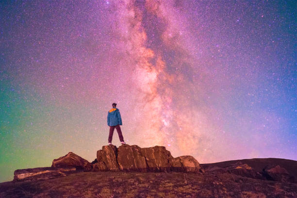 istock Galaxy and a man on the mountain 926530240
