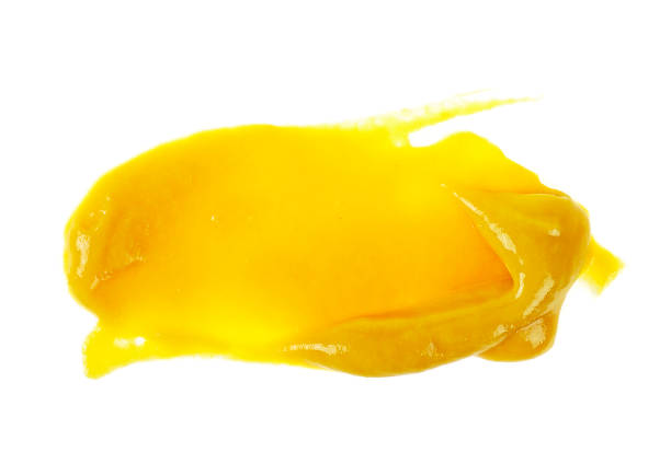 istock Mustard sauce. Splash of mustard on a white background. 926533950