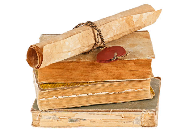 istock Old books and vintage paper scroll isolated on white background 926534330