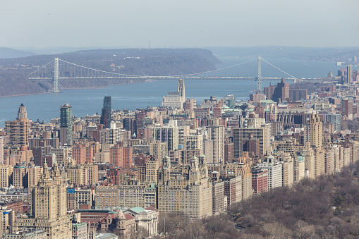 Panoramic elevated view of Central Park, Upper West Side and the George Washington Bridge with Hudson River in Fall. Manhattan, New York City, USA