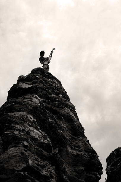istock teen rocker on rock silhoutte 92653833