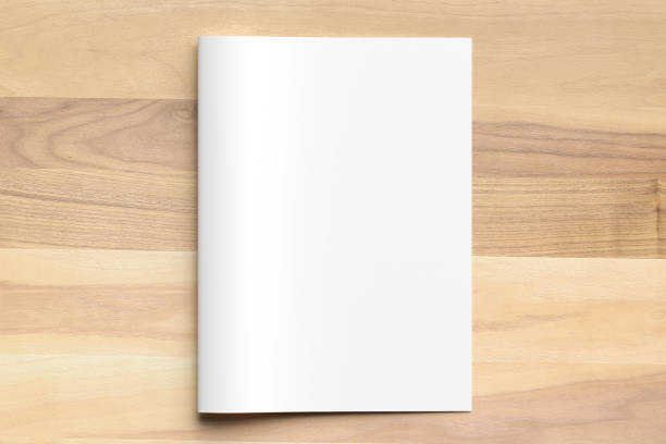 istock Blank Bi fold A4 size brochure mock up on wooden background. 3D illustrating. 926539336