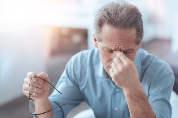 istock Nice pleasant man taking off his glasses 926539442