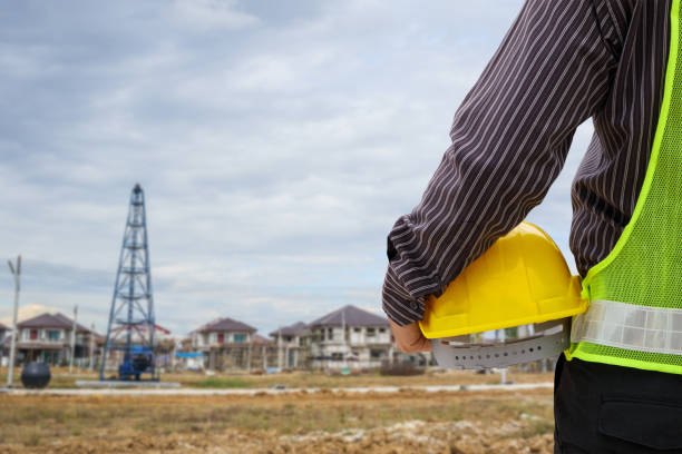 istock professional engineer worker at the house building construction site 926539476