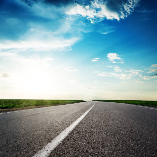 istock road to horizon in sunset 926542176