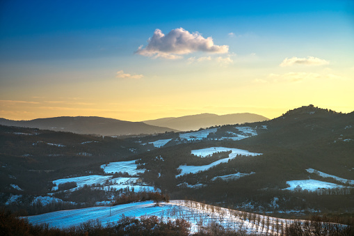 Snow in Tuscany. Winter panorama view at sunset. Siena, Italy