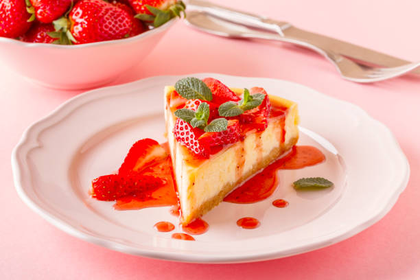 istock homemade cheesecake with strawberries on pink background 926543308