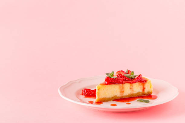 istock homemade cheesecake with strawberries on pink background 926543590
