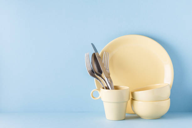 istock Crockery and cutlery on a blue pastel background 926546022