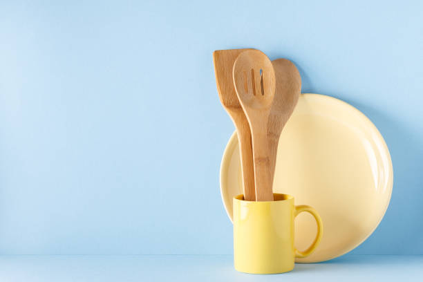 istock Crockery and cutlery on a blue pastel background 926546036