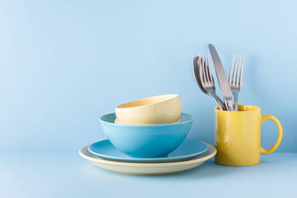istock Crockery and cutlery on a blue pastel background 926546062