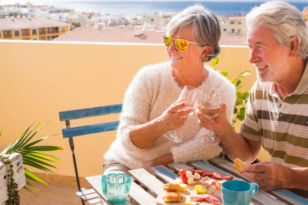 istock senior couple sitting at the counter 926548270