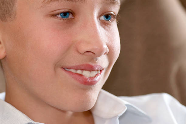Face of a young boy with Downs Syndrome