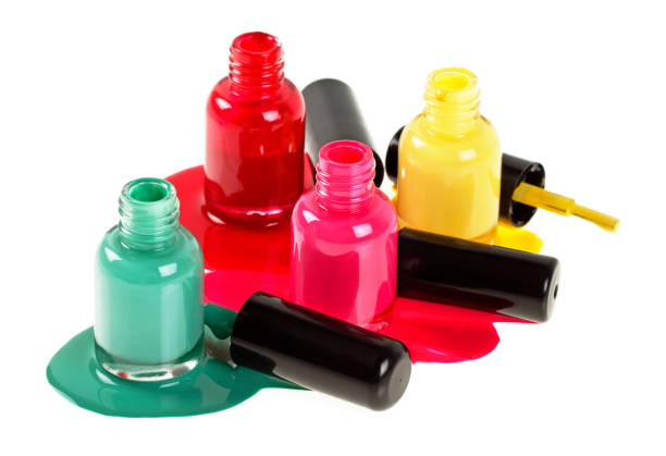 istock Bottles with spilled nail polish over white background 926554140