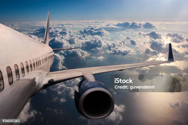 Body Of An Airplane Flying Through Dark Clouds Stock Photo - Download Image Now - Airplane, Gliding, Aerospace Industry