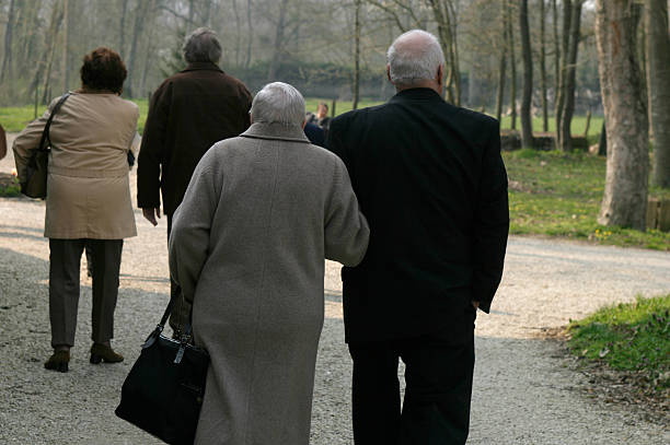 istock old friends walking in the garden 92655686