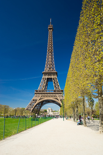 Sun shining over world famous Eiffel tower in Paris, France