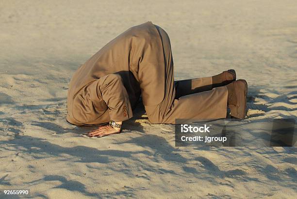 Businessman With Head Stuck In Sand At The Beach Stock Photo - Download Image Now - Ignorance, Careless, Head in the Sand