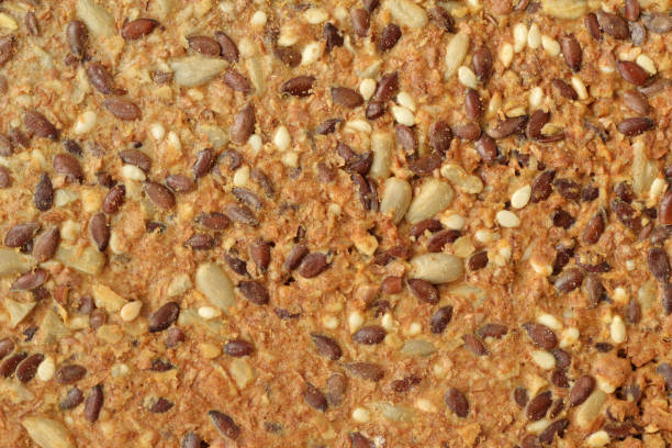 istock Texture background of crispy flatbread cracker with flax, sunflower and sesame seeds 926565166