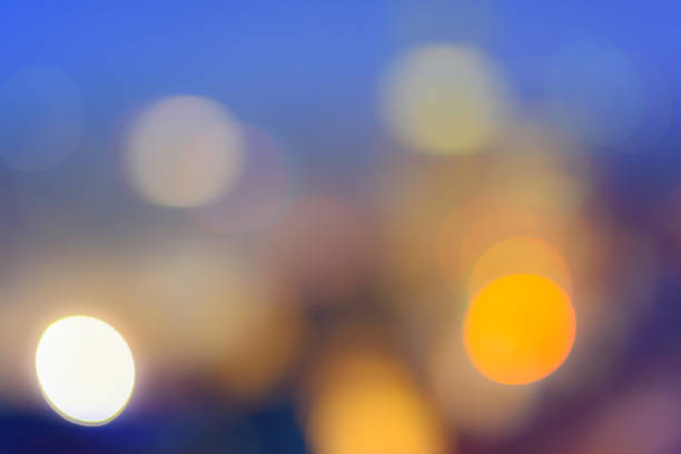 istock Abstract bokeh background. Defocused colored circles on a blue background. Place for text, copyspace. Out of focus blur. 926565956