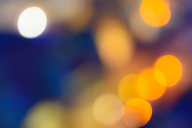 istock Abstract bokeh background. Defocused colored circles on a blue background. Place for text, copyspace. Out of focus blur. 926565962
