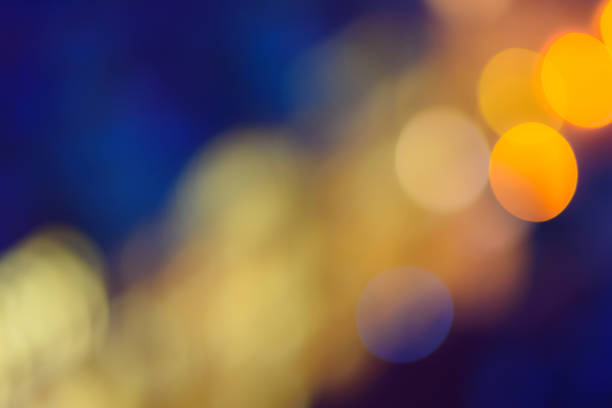 istock Abstract bokeh background. Defocused colored circles on a blue background. Place for text, copyspace. Out of focus blur. 926565978