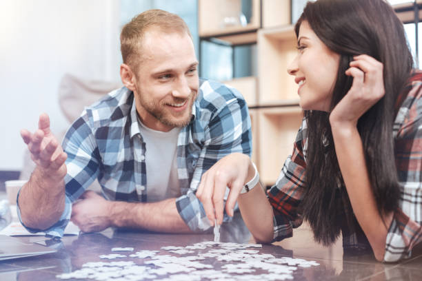 istock Positive delighted partners collecting puzzle 926567786