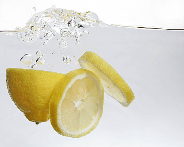 lemon splashing stock photo