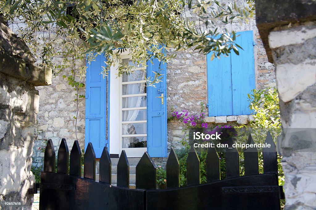 Over the garden gate  Blue Stock Photo