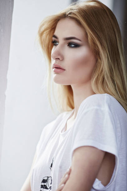 istock Blond female in a white t shirt. 926577208