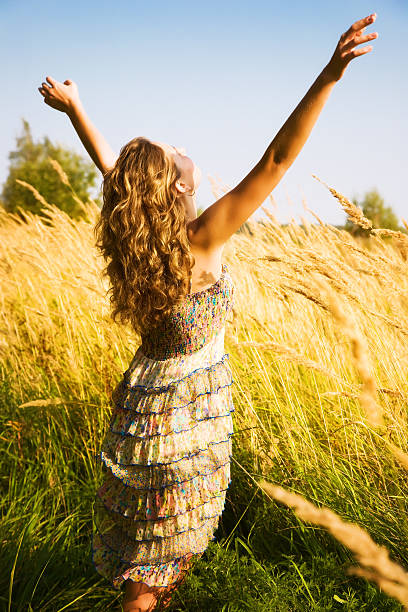 istock Young woman in a summer field 92657854