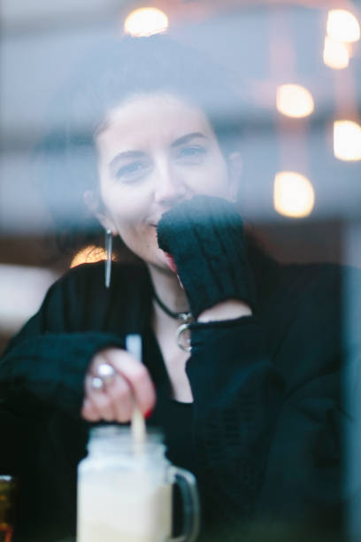 istock Woman drinking smoothie on cafe 926578992