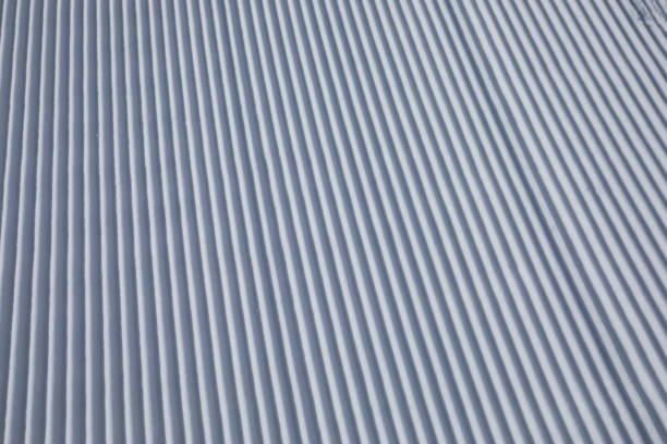 istock snow track lines on a ski slope left by a snowcat 926579830