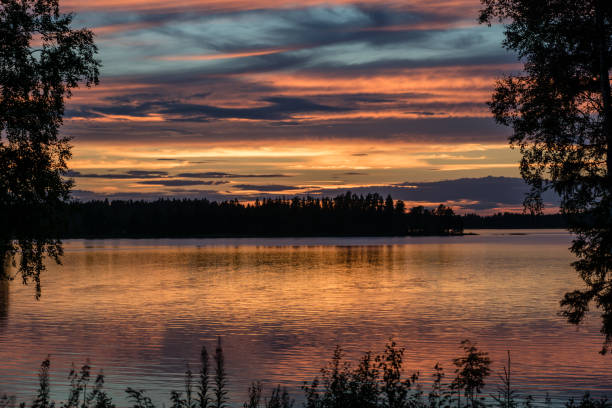 istock Beautiful view across a lake in colorful evening sunlight 926582750