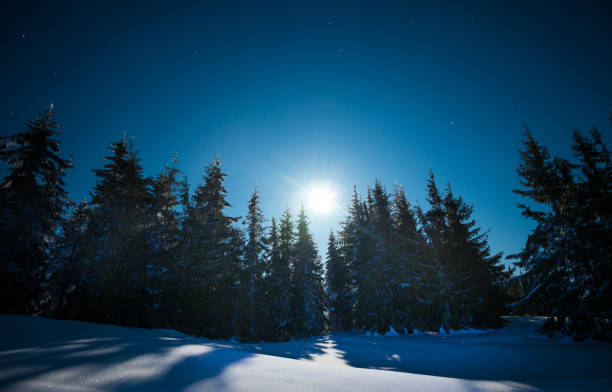 istock Night moon in the snowy mountains 926583334