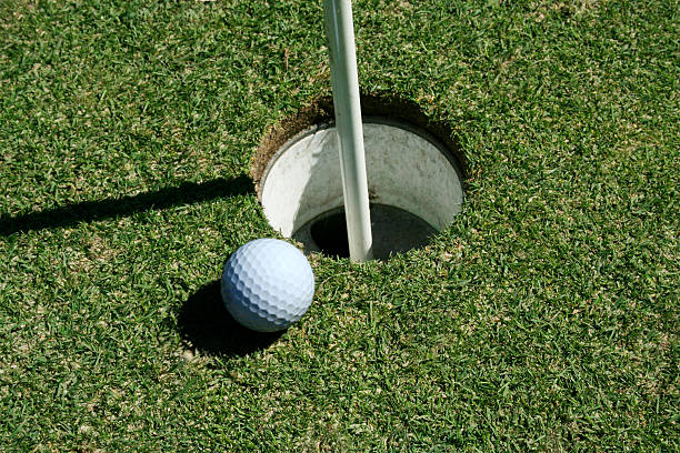 istock Golf Ball on green near hole 92658385