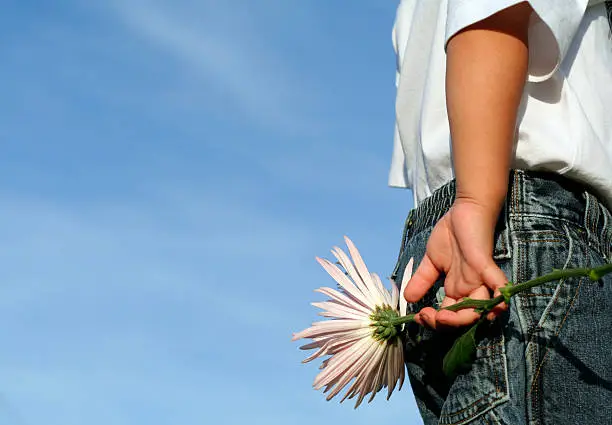 Photo of Boy holding flower