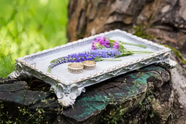 Wedding rings on a vintage tea-tray