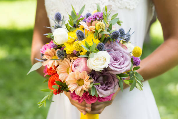 istock Bride holding bridal bouquet in her hands 926586916