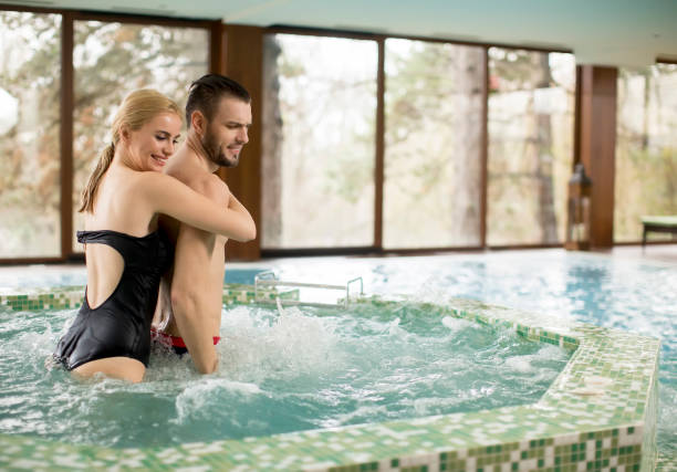 istock Loving couple relaxing in hot tub 926589064