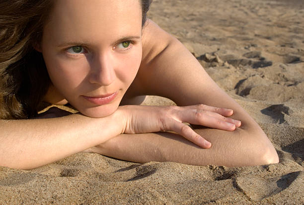 istock Girl laying on a beach-3 92659266