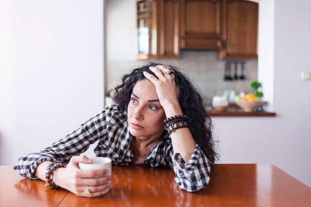 istock Young woman drinking coffee at home 926599314