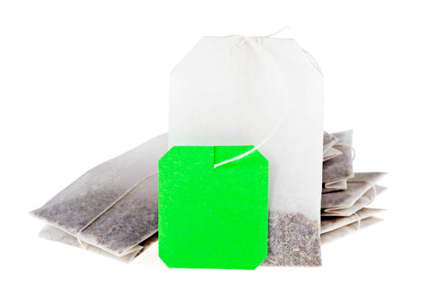 Close-up of tea bags isolated on white background