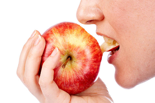 istock Girl eating a red apple 92660401