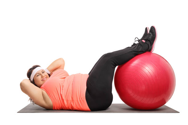 istock Overweight woman doing crunches on an exercise mat 926606208